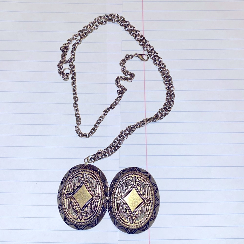 Costume Jewelery locket with long chain good condition. Purchase two items Free